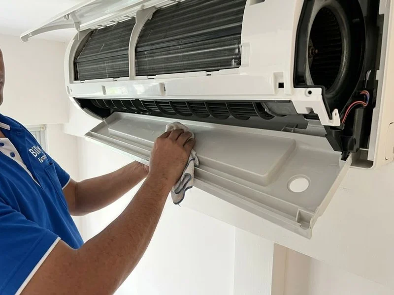 Clean aircon drain pan after professional clearing, flushing, and chemical treatment