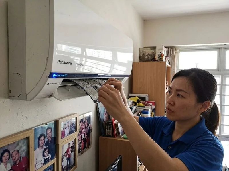 Panasonic aircon with nanoe-X indicator light in a Singapore living room