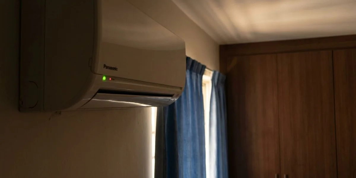 Aircon indoor unit with blinking LED light indicator on a wall-mounted split system